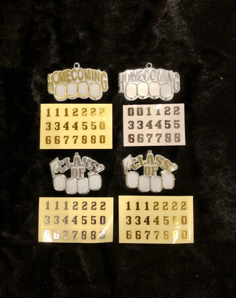 “HOMECOMING” EMBLEM WITH GOLD MET. STICKERS - Homecoming Supplies